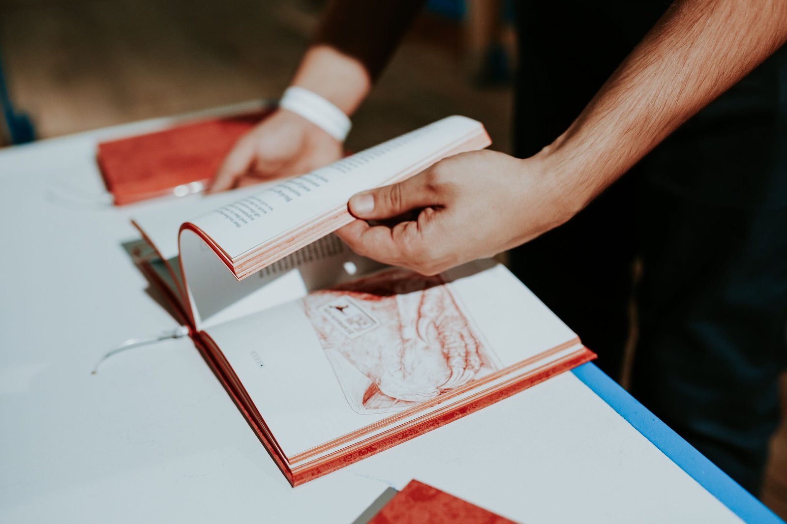 kaboompics_red-book-on-a-white-table-2190