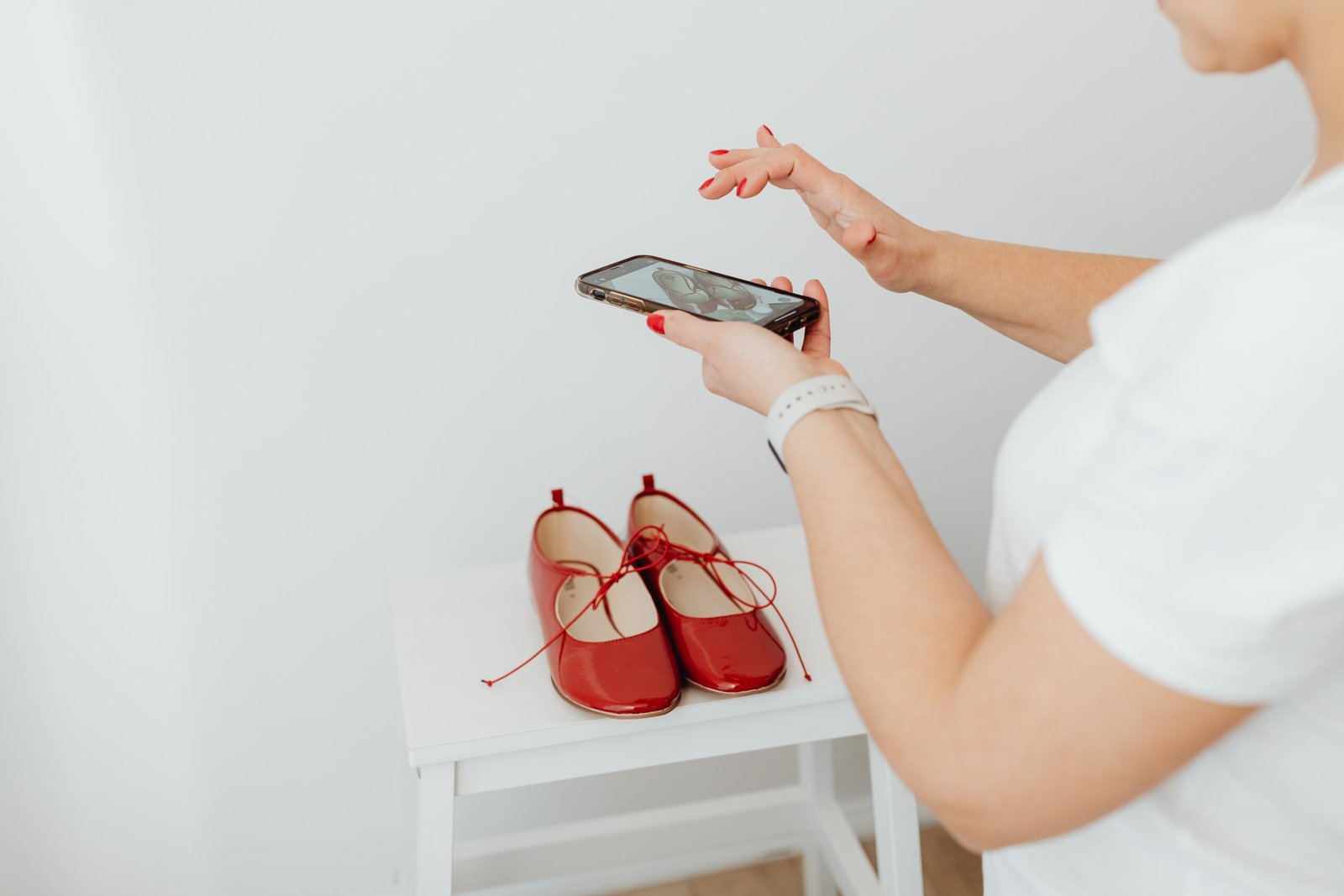 kaboompics_woman-takes-photos-of-products-she-will-sell-online-red-shoes-20601